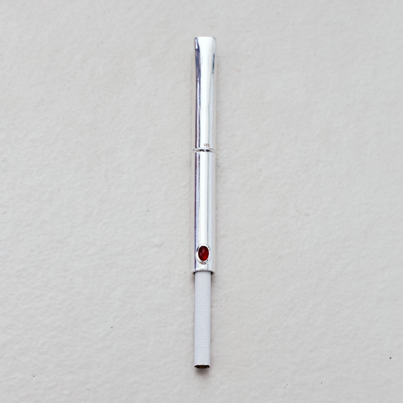 THE CIGARETTE HOLDER