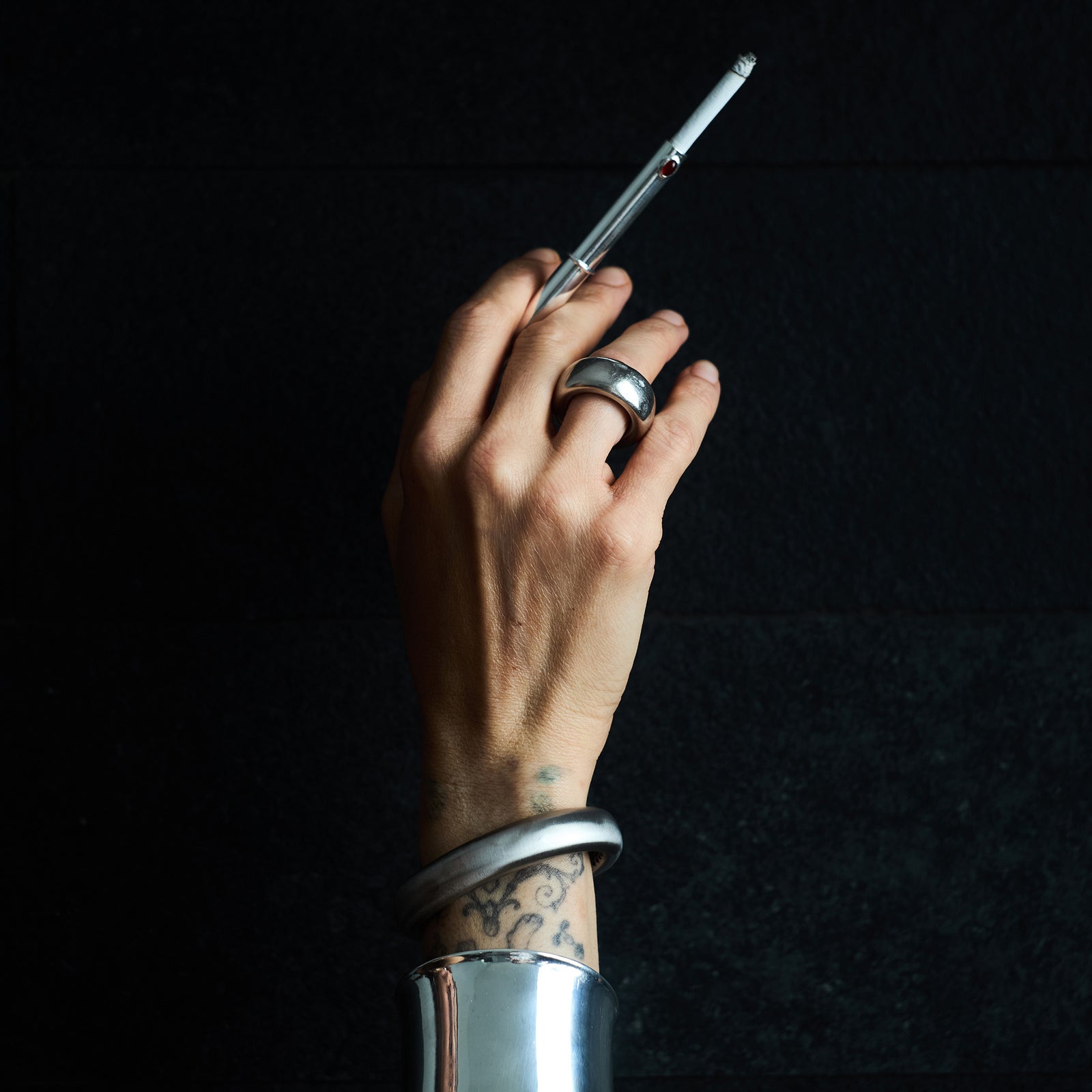 THE CIGARETTE HOLDER